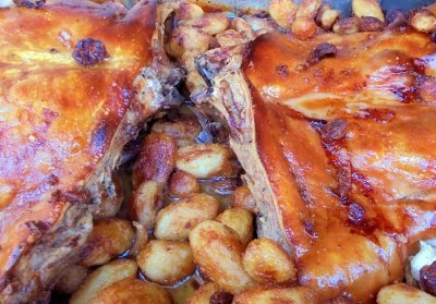 Baked suckling pig with potatoes